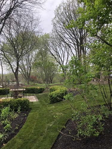 Lawn and walkway project featuring natural stone and professionally laid sod