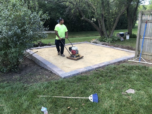 Custom fire feature built with paver bricks by Plant Garden Landscaping